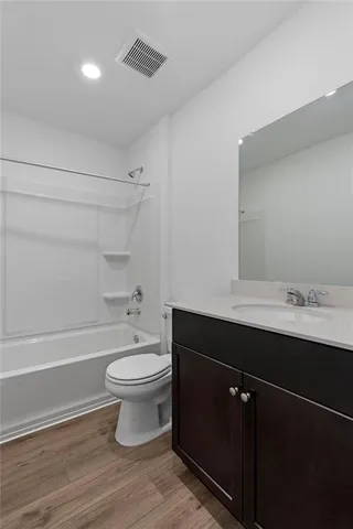 a bathroom with a sink a toilet and a bathtub