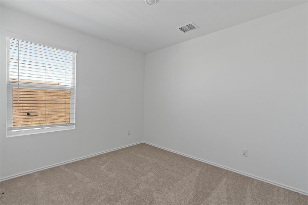 444 Marty Allen Loop Jarrell, TX 76537 - Photo 14 of 23 an empty room with a window
