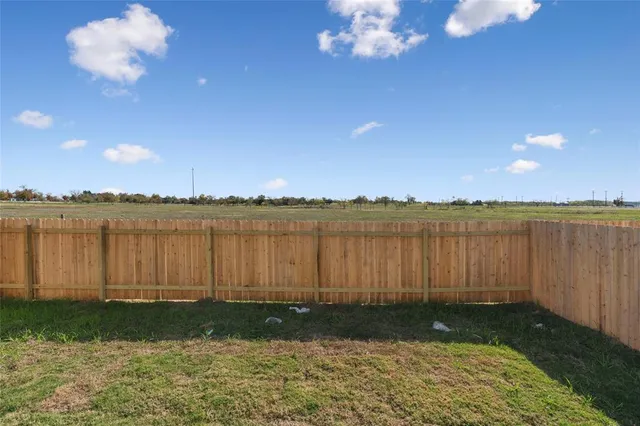 a view of a lake with houses in the back