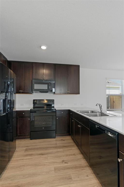 444 Marty Allen Loop Jarrell, TX 76537 - Photo 2 of 23 a kitchen with stainless steel appliances granite countertop a sink stove and oven