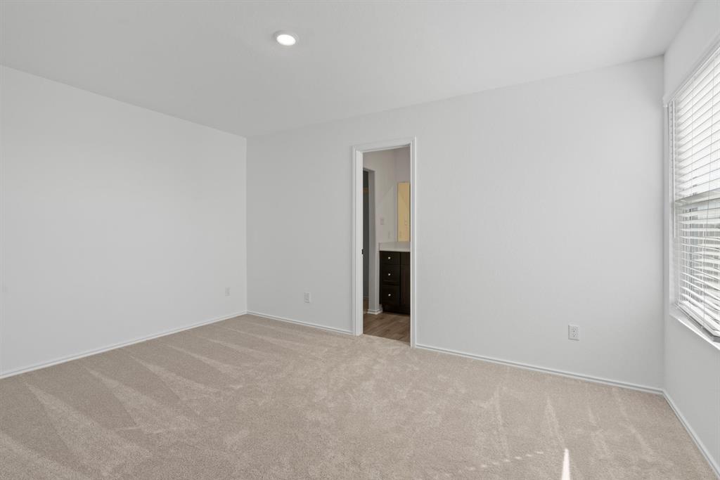 444 Marty Allen Loop Jarrell, TX 76537 - Photo 21 of 23 an empty room with windows