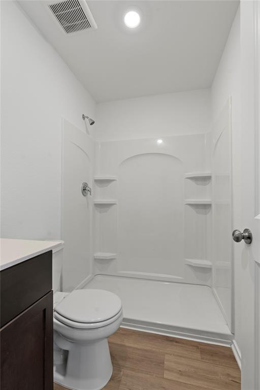444 Marty Allen Loop Jarrell, TX 76537 - Photo 23 of 23 a bathroom with a toilet a sink and shower