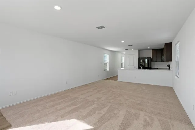 a view of a kitchen with a sink and cabinets