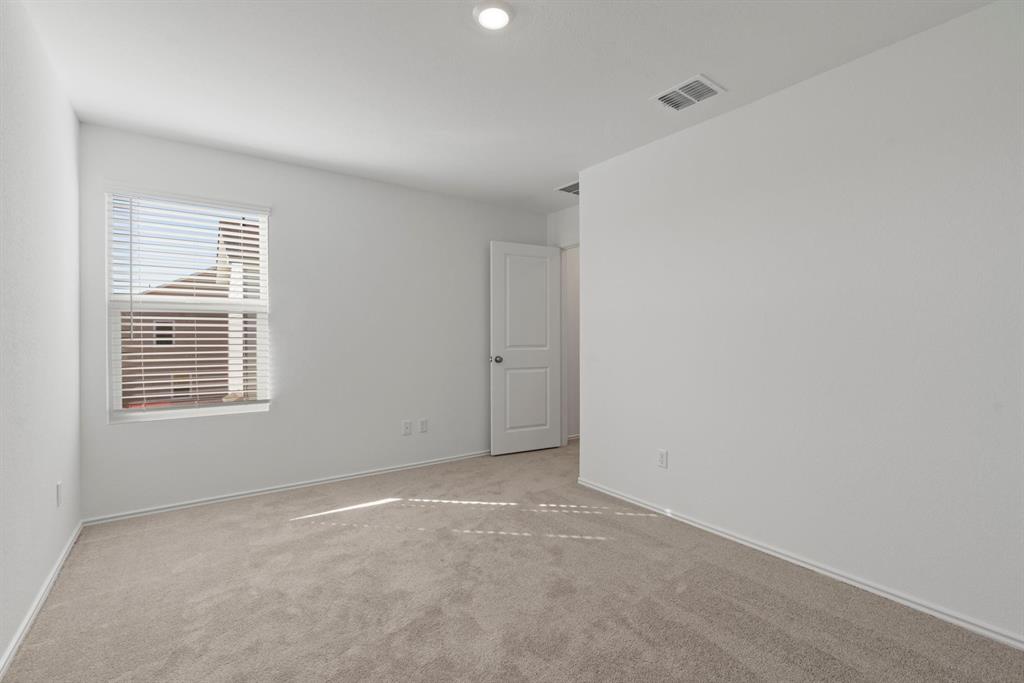 444 Marty Allen Loop Jarrell, TX 76537 - Photo 8 of 23 a view of an empty room with a window