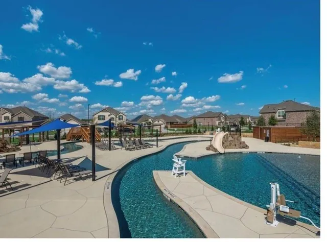 an outdoor space with furniture and garden