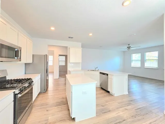 an aerial view of a house with yard