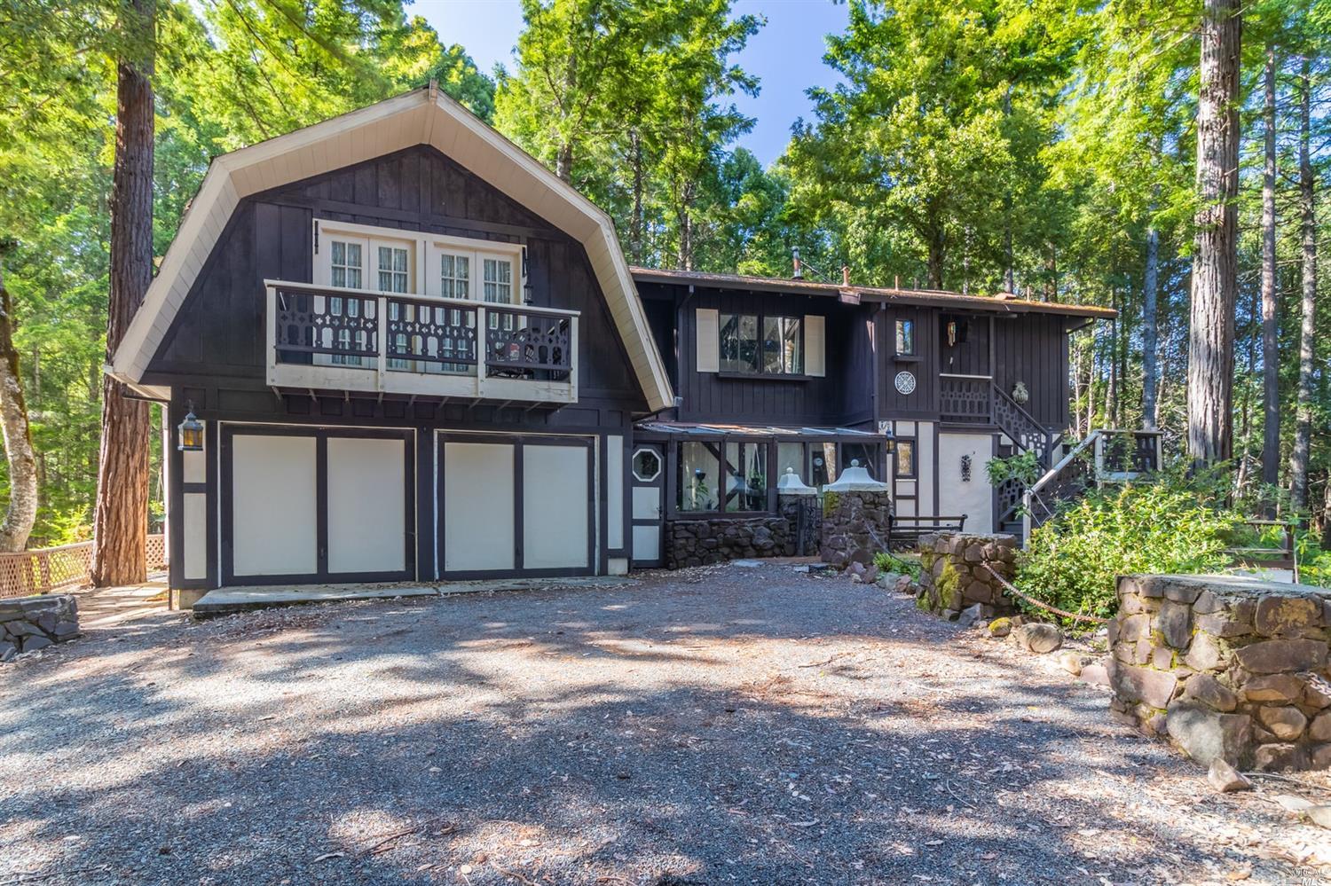 24531 Ridge Road Willits, CA 95490 - Photo 1 of 1 a front view of a house with a garden