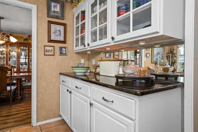 a kitchen with a stove and cabinets