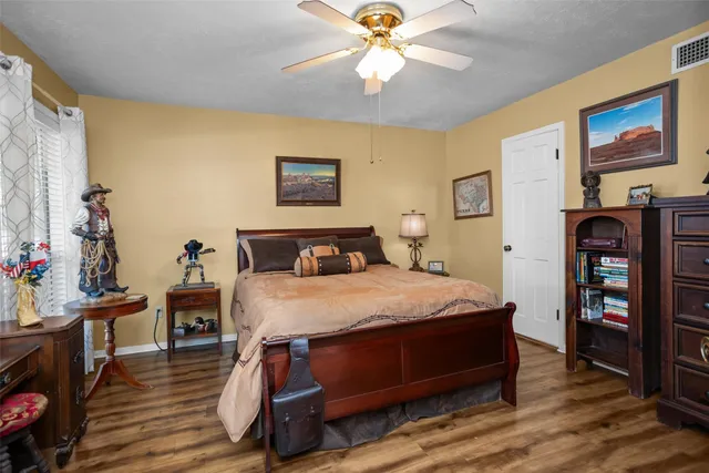 a bed room with a bed and dresser