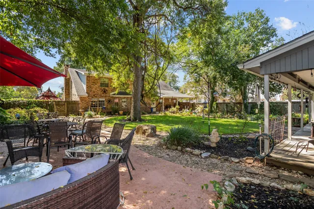 a view of a house with a tree in the background