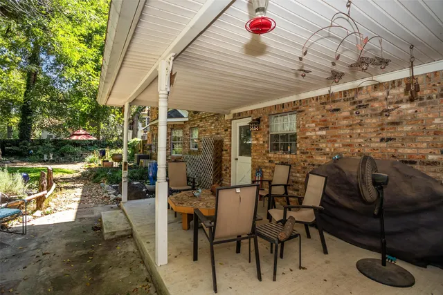 a view of a house with garden and sitting area