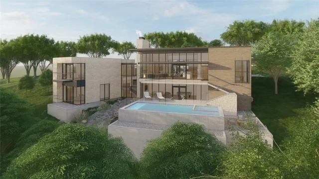 a view of a house with a yard and sitting area