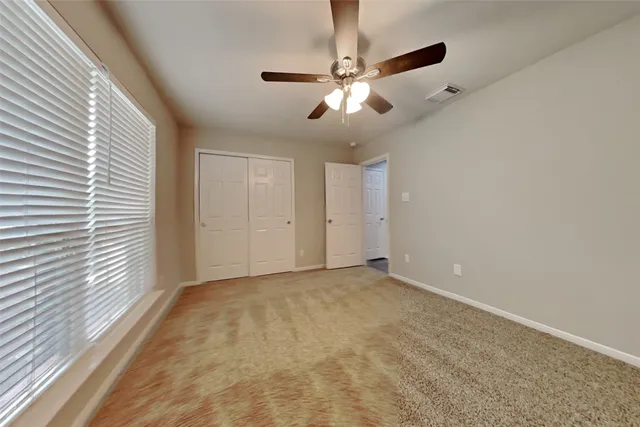 en view of an empty room with a window