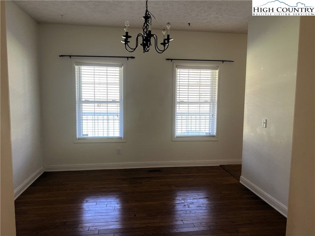 1371 West Buffalo Road West Jefferson, NC 28694 - Photo 15 of 31 a view of an empty room with wooden floor and a window