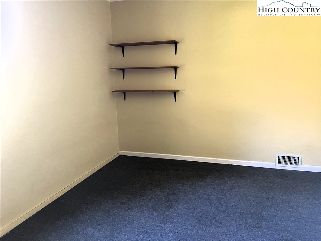 1371 West Buffalo Road West Jefferson, NC 28694 - Photo 16 of 31 a view of a room with shelf