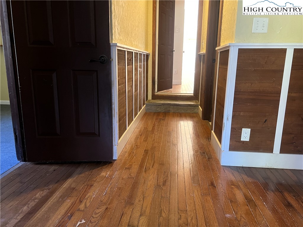 1371 West Buffalo Road West Jefferson, NC 28694 - Photo 19 of 31 a view of a hallway with wooden floor