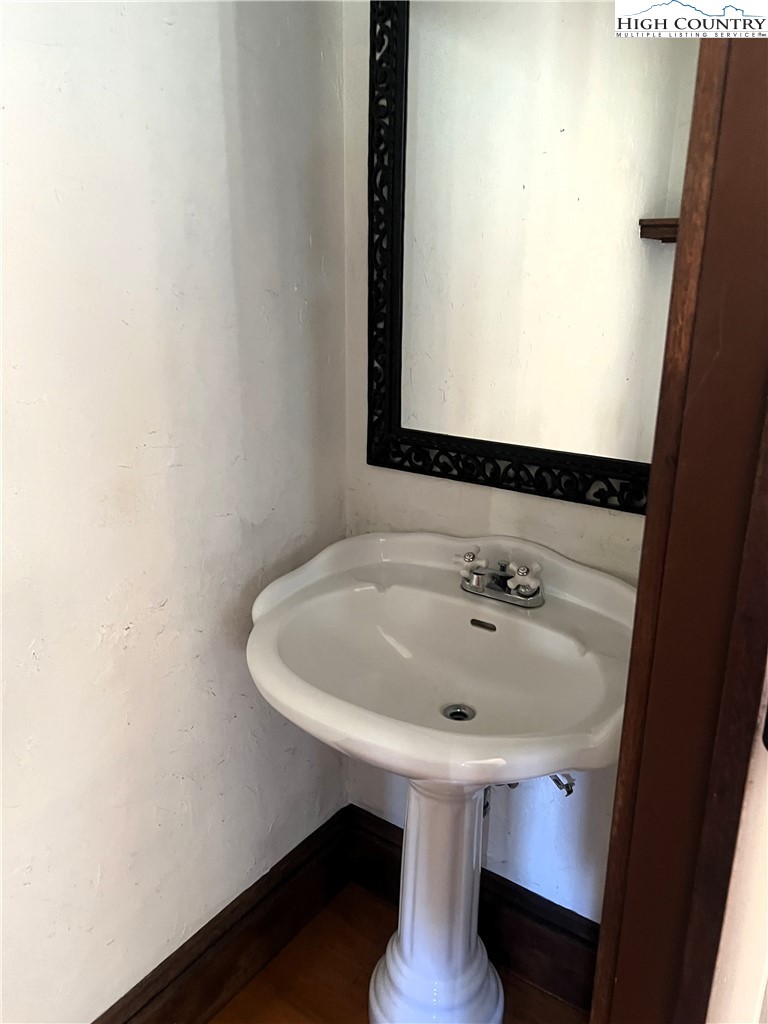 1371 West Buffalo Road West Jefferson, NC 28694 - Photo 20 of 31 a bathroom with a sink and a mirror