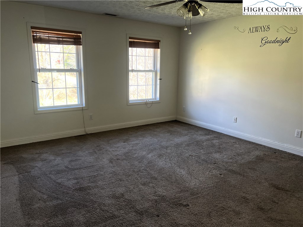 1371 West Buffalo Road West Jefferson, NC 28694 - Photo 22 of 31 an empty room with a window