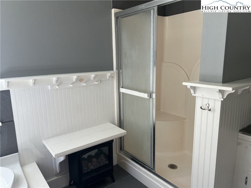 1371 West Buffalo Road West Jefferson, NC 28694 - Photo 25 of 31 a bathroom with a sink and a mirror