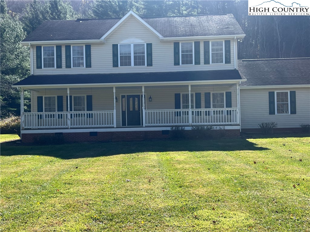 1371 West Buffalo Road West Jefferson, NC 28694 - Photo 30 of 31 a house that has a swimming pool in front of it