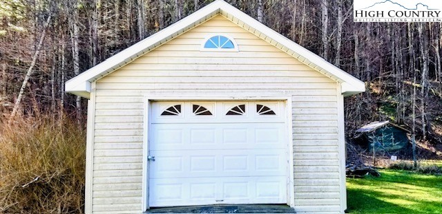 1371 West Buffalo Road West Jefferson, NC 28694 - Photo 31 of 31 a view of a small space in the yard and covered with tall trees