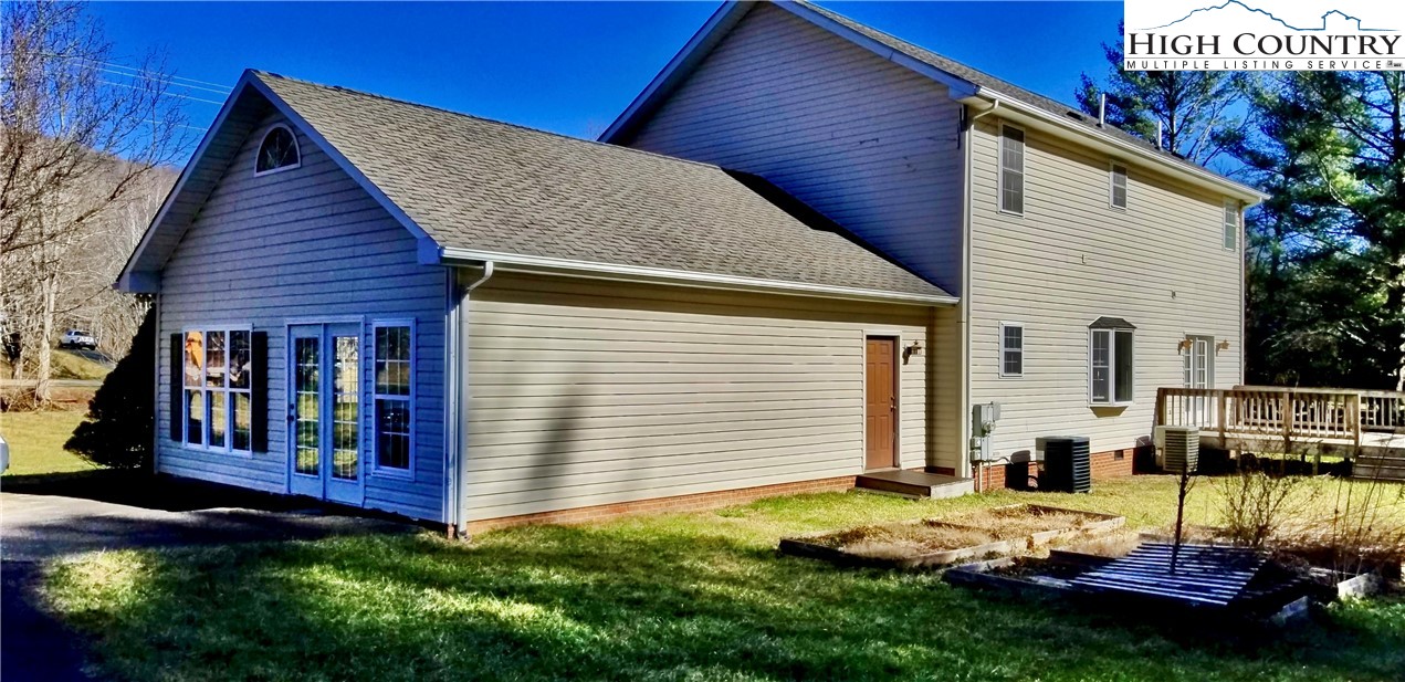 1371 West Buffalo Road West Jefferson, NC 28694 - Photo 9 of 31 a view of a house with backyard and porch