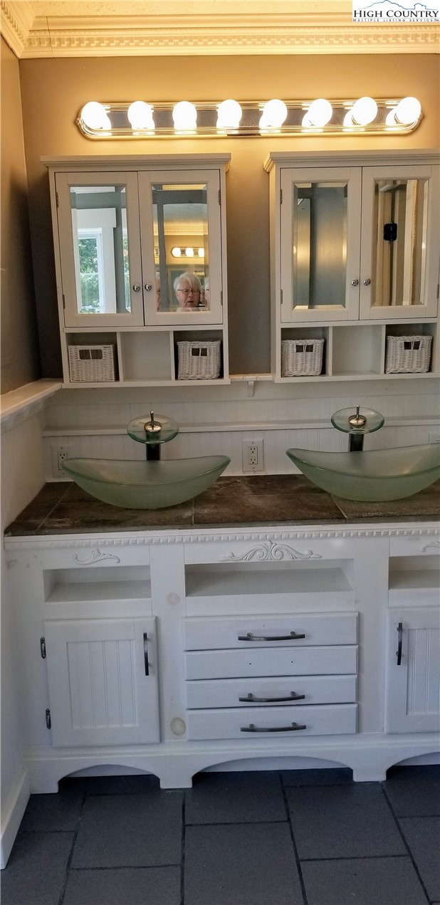 1371 West Buffalo Road West Jefferson, NC 28694 - Photo 10 of 31 a view of a bathroom sink and mirror