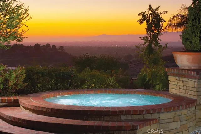 a view of a swimming pool with a yard