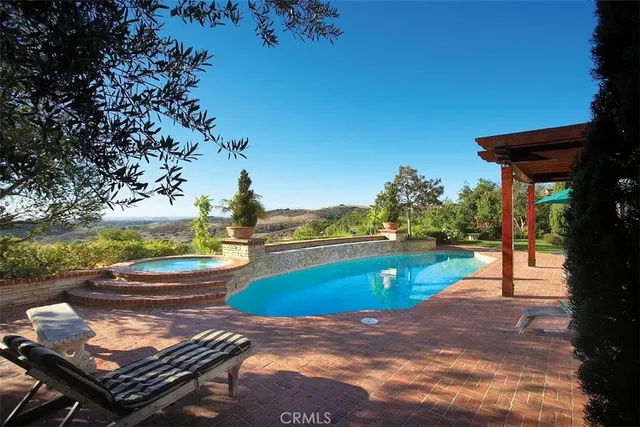 a view of a patio with swimming pool