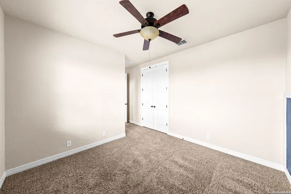 a bed room with a bed and a window