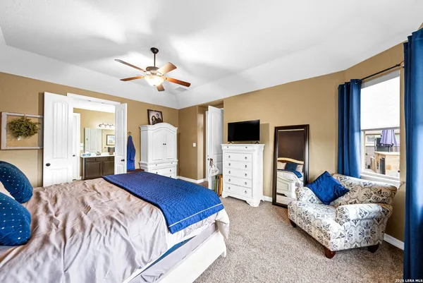 a bathroom with a tub shower and sink