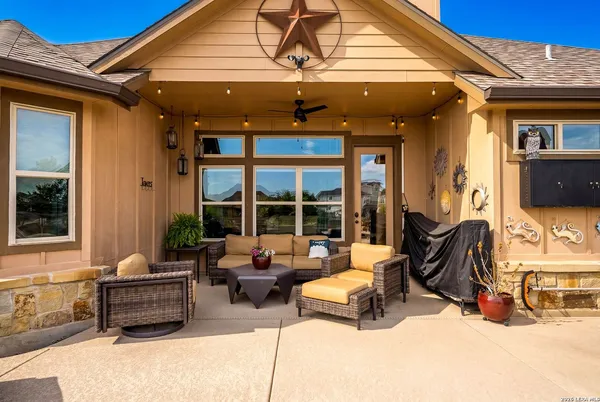 a outdoor living space with furniture and city view
