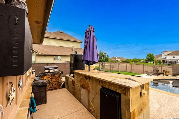 a view of a garden with sitting area