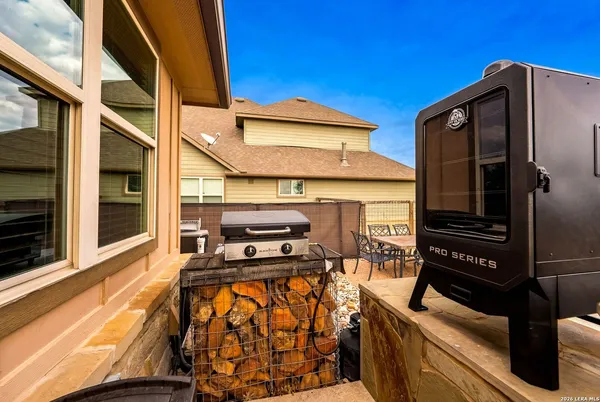 a view of a swimming pool with a table and chairs