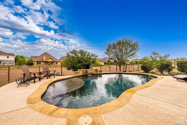 a outdoor living space with furniture and a fireplace
