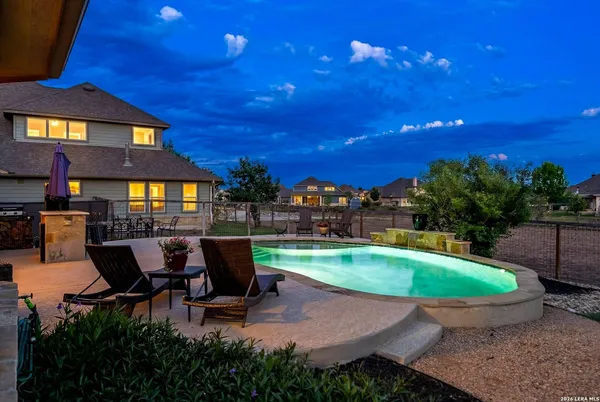 a view of a patio with swimming pool