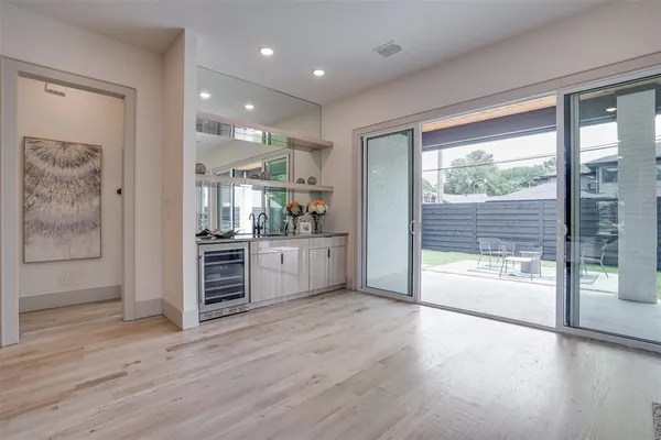 a view of a kitchen with a sink and a large window