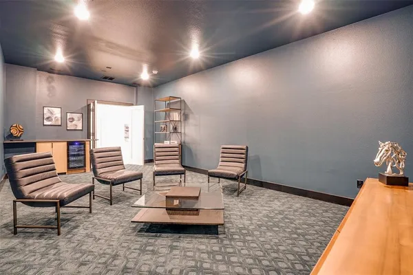 a room with chairs and wooden floor