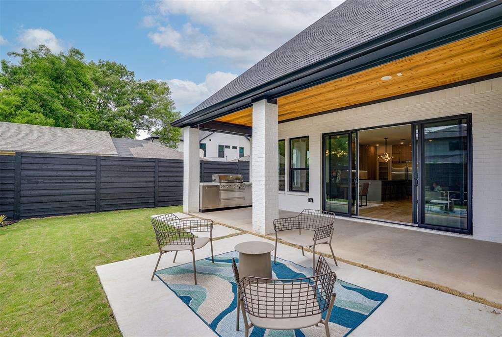 3732 Valley Ridge Road Dallas, TX 75220 - Photo 28 of 35 Fenced backyard with a patio and an outdoor kitchen