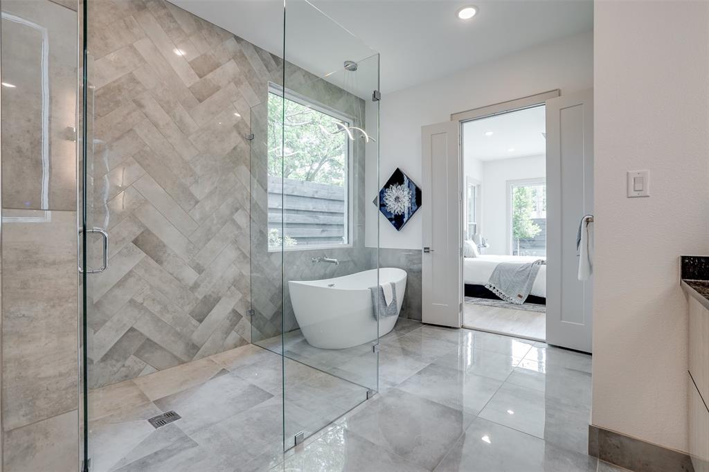 3732 Valley Ridge Road Dallas, TX 75220 - Photo 33 of 35 Bathroom with ensuite bath, tile walls, vanity, a shower stall, and a soaking tub