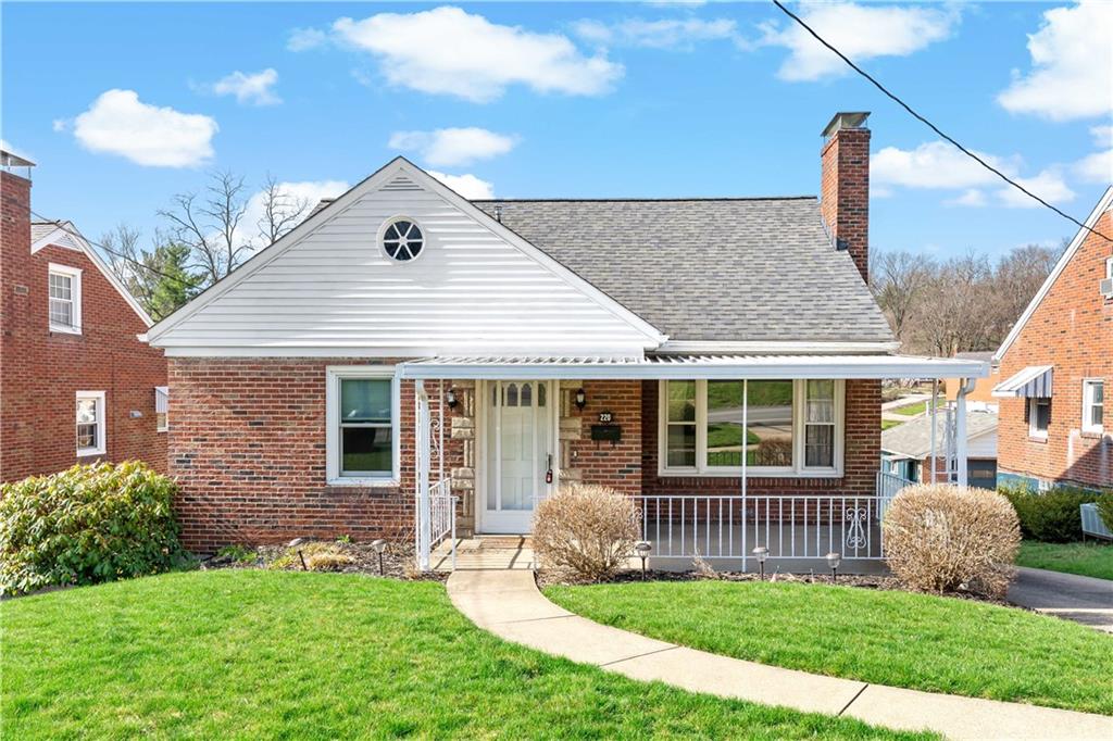a front view of a house with a garden and plants