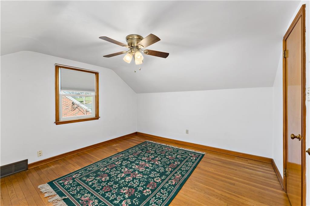 220 McClelland Road Canonsburg, PA 15317 - Photo 17 of 38 a view of an empty room with a window and a ceiling fan