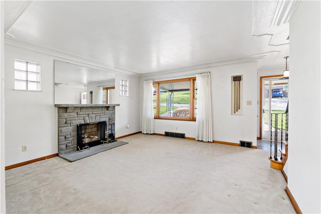 220 McClelland Road Canonsburg, PA 15317 - Photo 2 of 38 an empty room with furniture and a fireplace