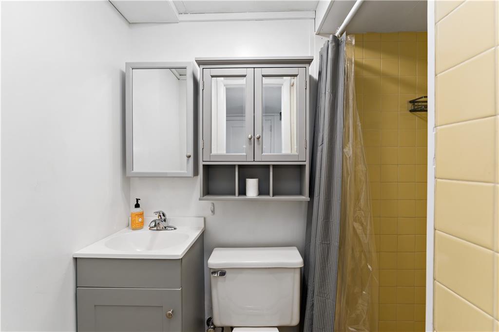 220 McClelland Road Canonsburg, PA 15317 - Photo 21 of 38 a bathroom with a sink a toilet and mirror