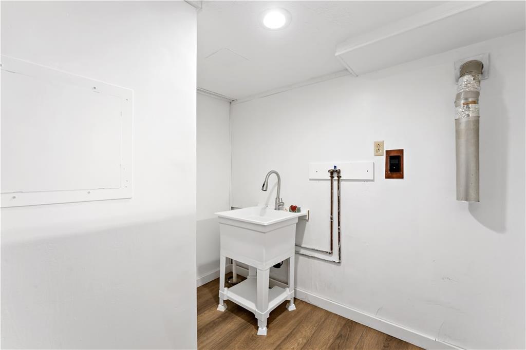 220 McClelland Road Canonsburg, PA 15317 - Photo 24 of 38 a white room with a sink and a mirror