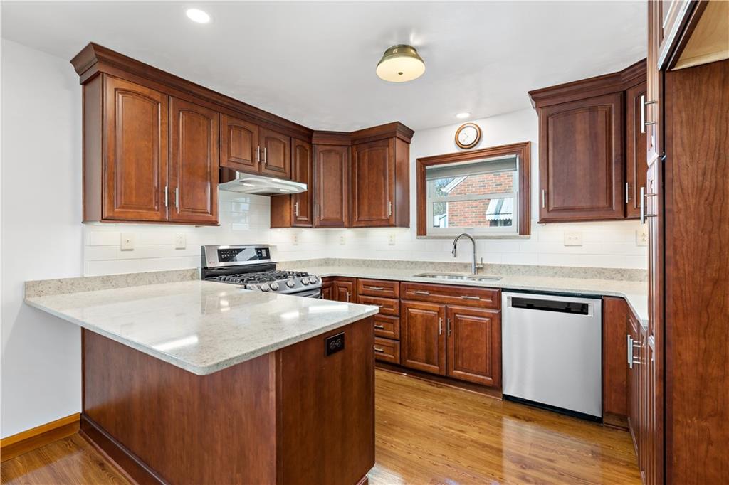 220 McClelland Road Canonsburg, PA 15317 - Photo 7 of 38 a kitchen with a sink stove and cabinets