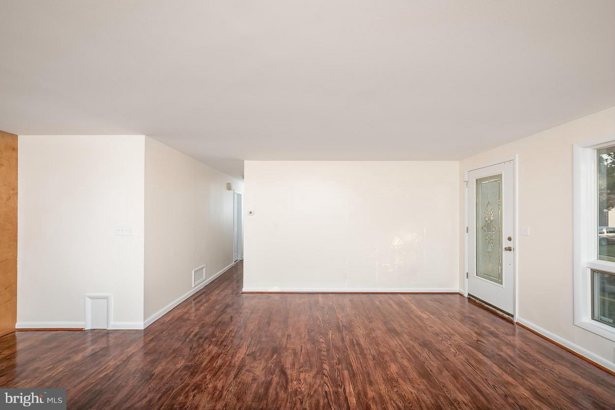 9120 Bengal Road Randallstown, MD 21133 - Photo 11 of 30 an empty room with wooden floor