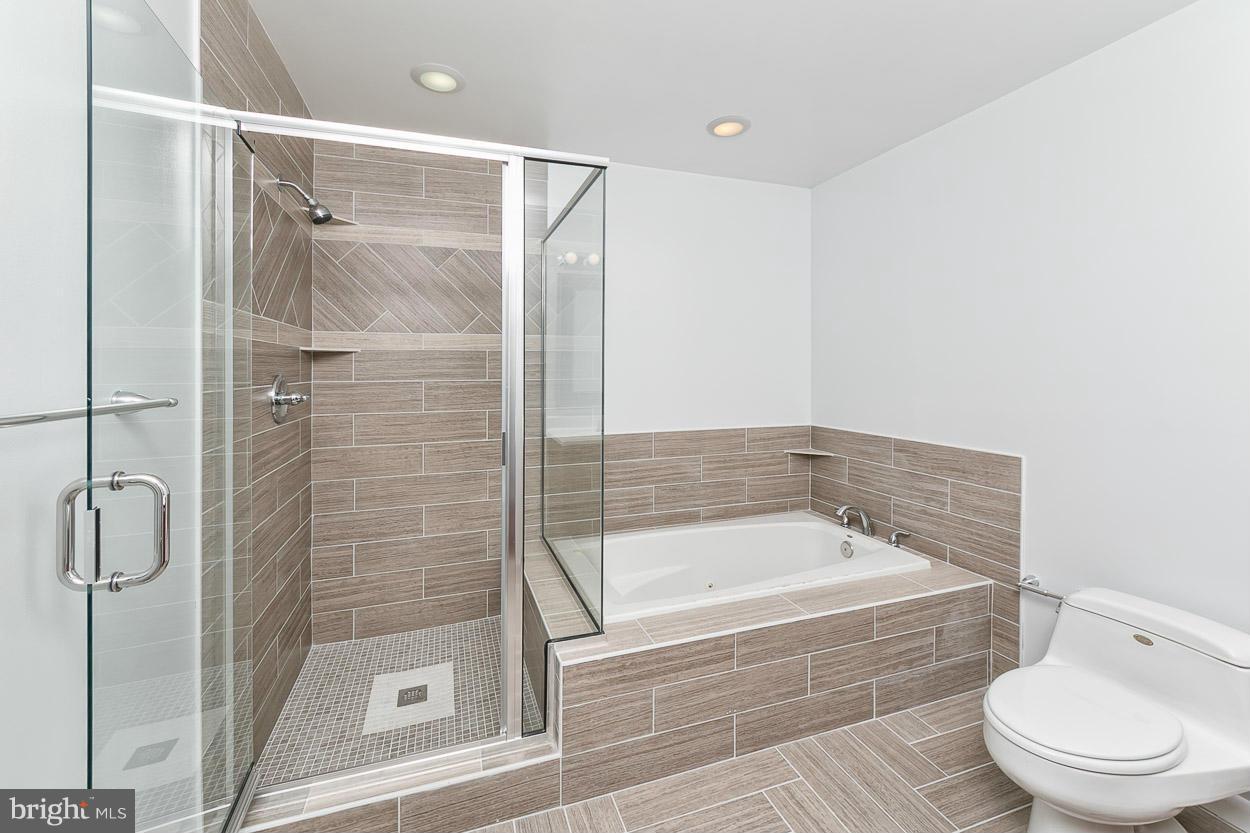 9120 Bengal Road Randallstown, MD 21133 - Photo 14 of 30 a bathroom with a bathtub and a shower