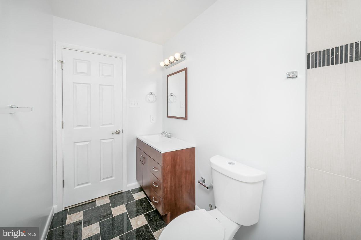 9120 Bengal Road Randallstown, MD 21133 - Photo 18 of 30 a white toilet sitting next to a shower curtain