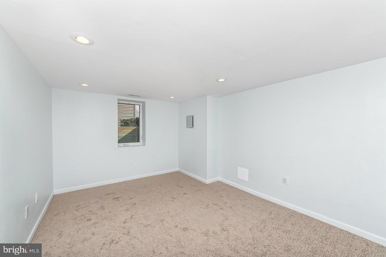 9120 Bengal Road Randallstown, MD 21133 - Photo 22 of 30 an empty room with a workbench